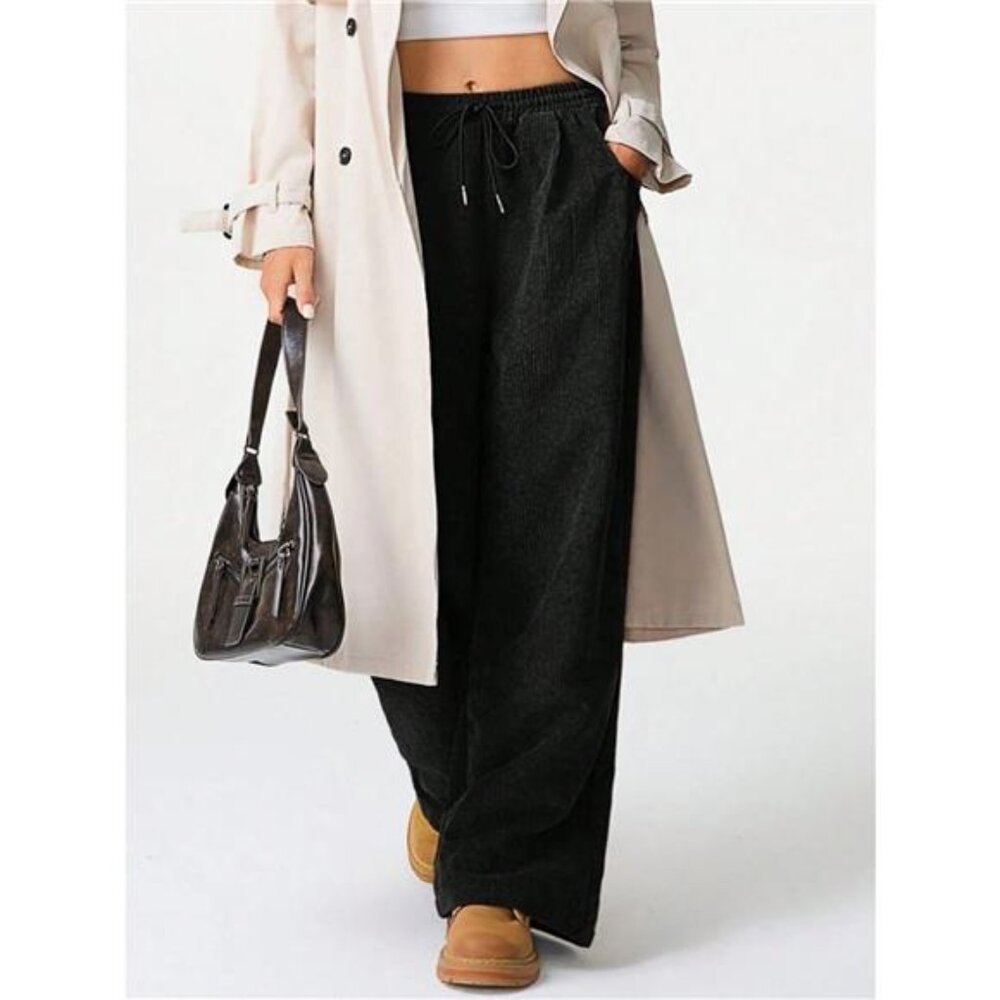 A Classy Chic Boutique Black Pants with Cream Coat